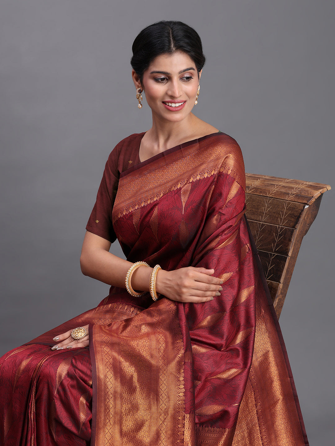 Astita Maroon Banarasi Silk Saree with Copper Zari Woven Pallu & Feather Butta – Wedding & Festive Wear