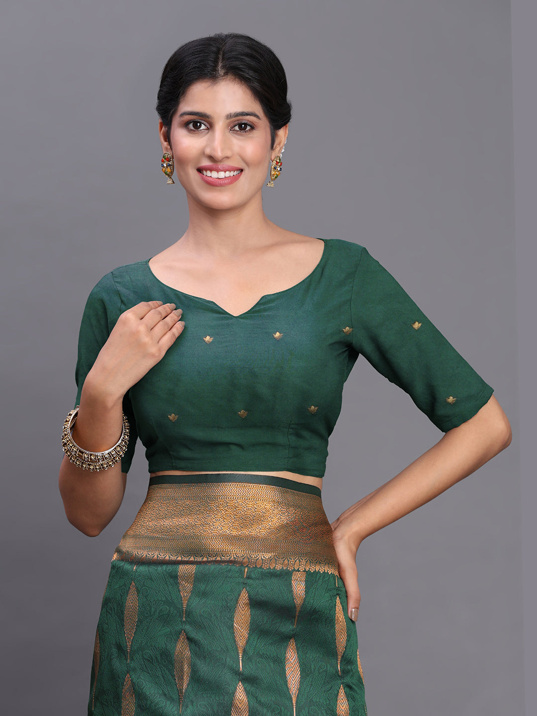 Astita Dark Green Banarasi Silk Saree with Copper Zari Woven Pallu & Feather Butta – Wedding & Festive Wear