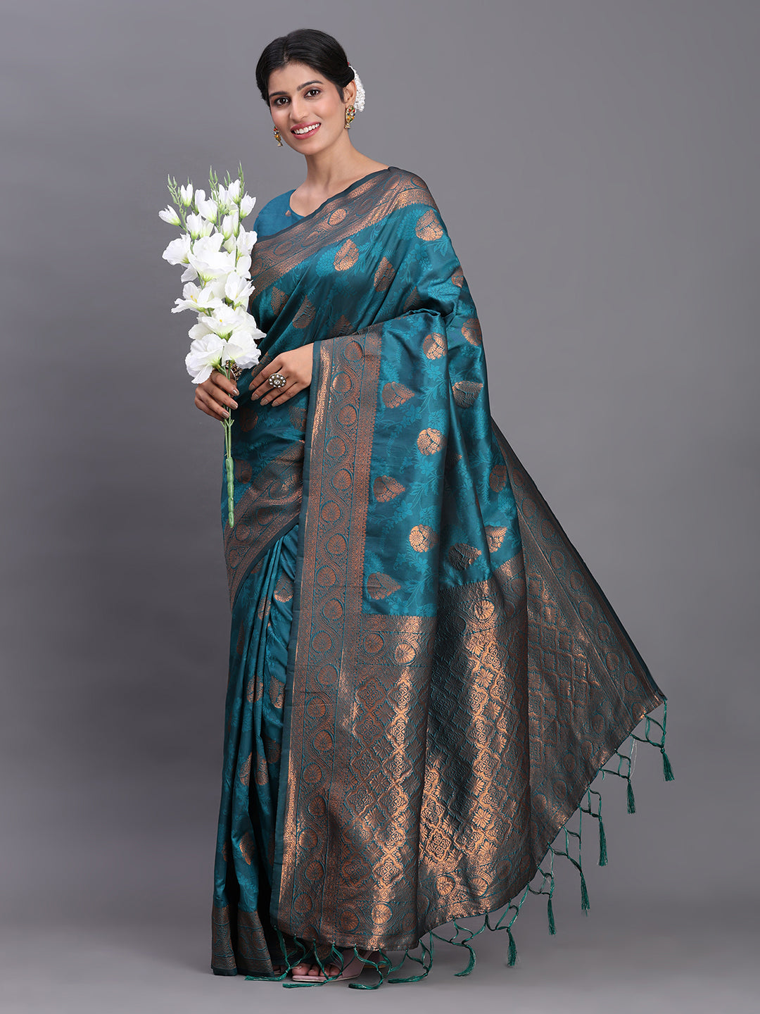 Astita Teal Blue Banarasi Silk Saree with Copper Zari Woven Pallu & Feather Butta – Wedding & Festive Wear