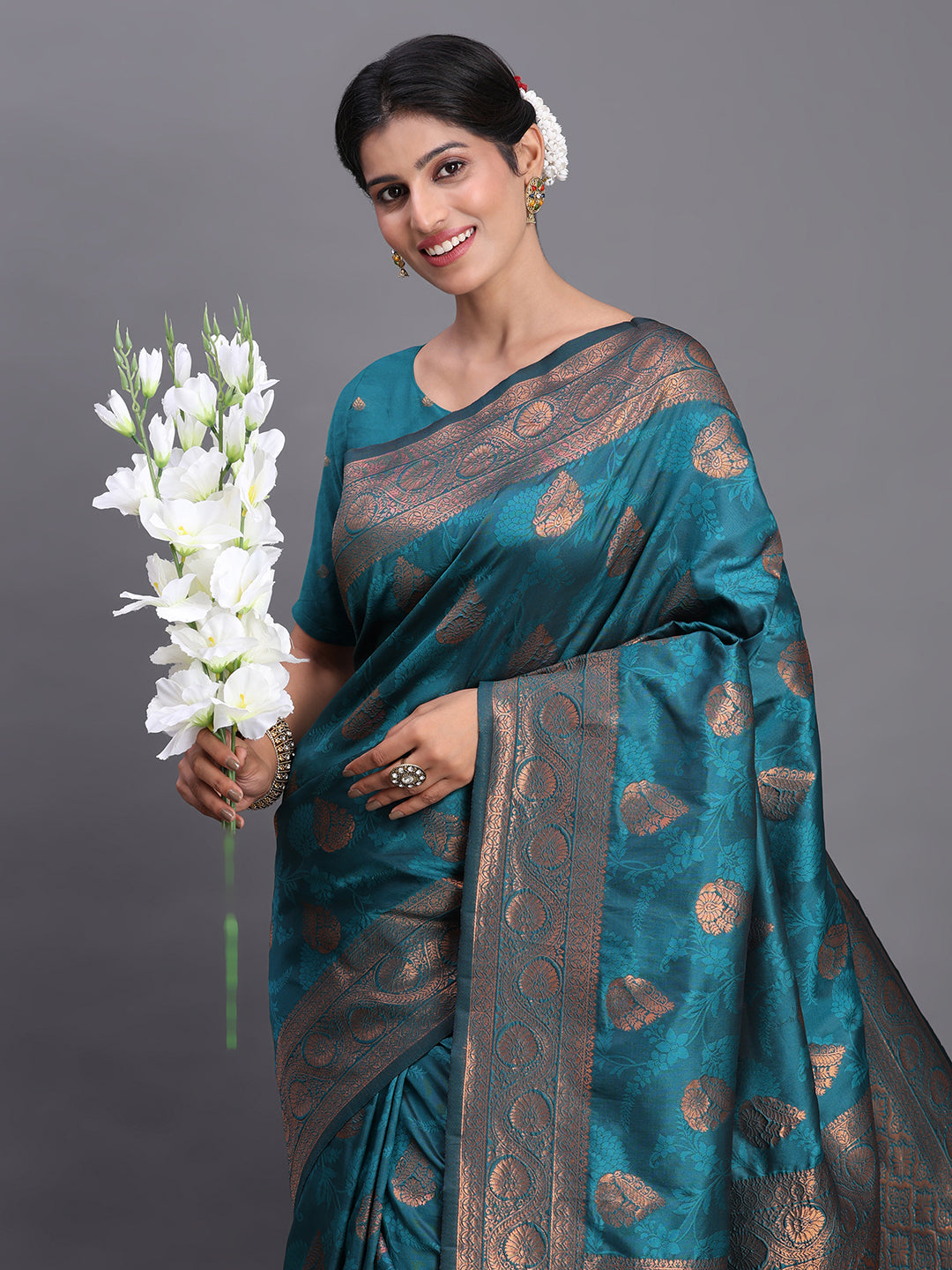 Astita Teal Blue Banarasi Silk Saree with Copper Zari Woven Pallu & Feather Butta – Wedding & Festive Wear