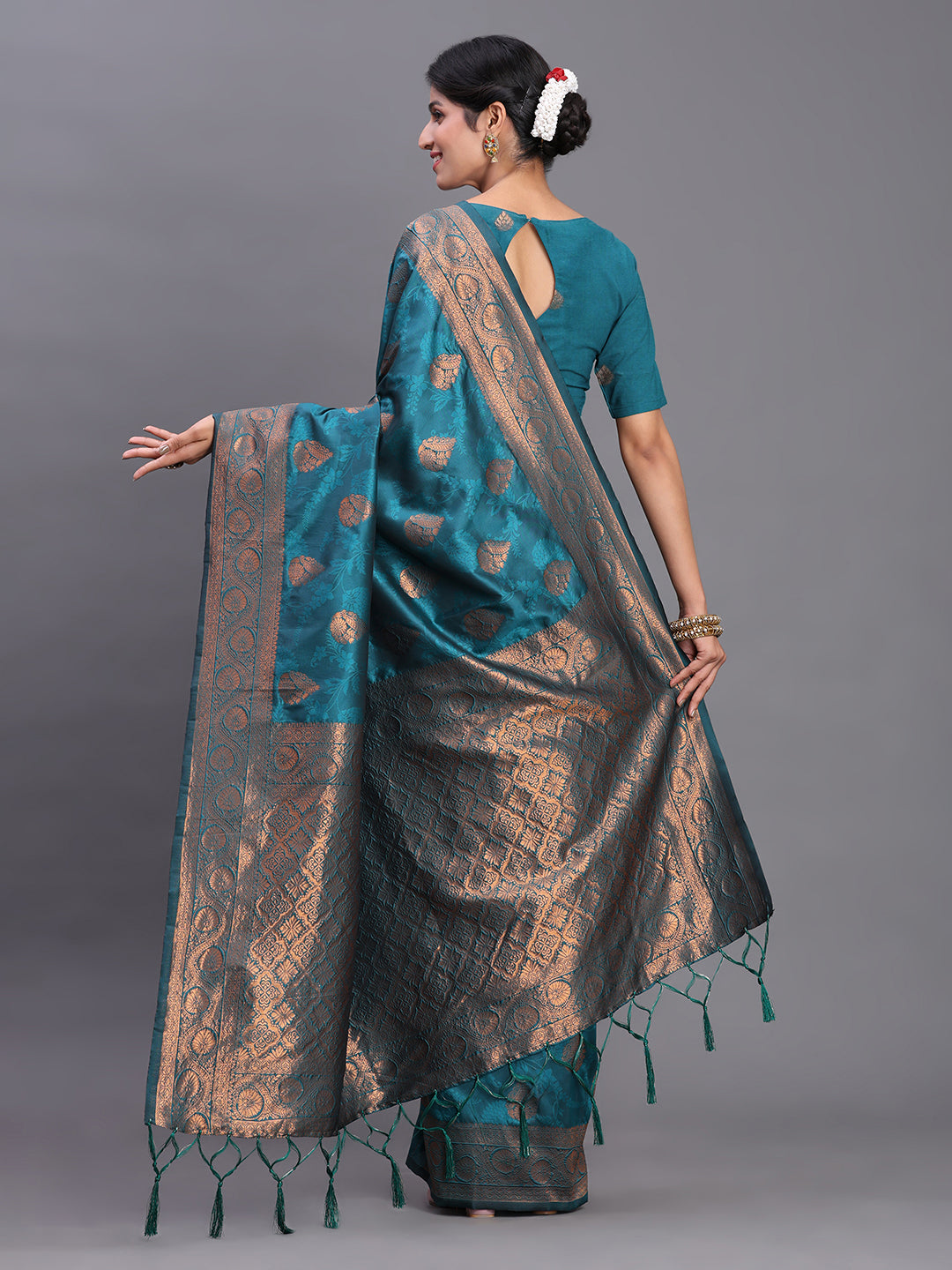 Astita Teal Blue Banarasi Silk Saree with Copper Zari Woven Pallu & Feather Butta – Wedding & Festive Wear
