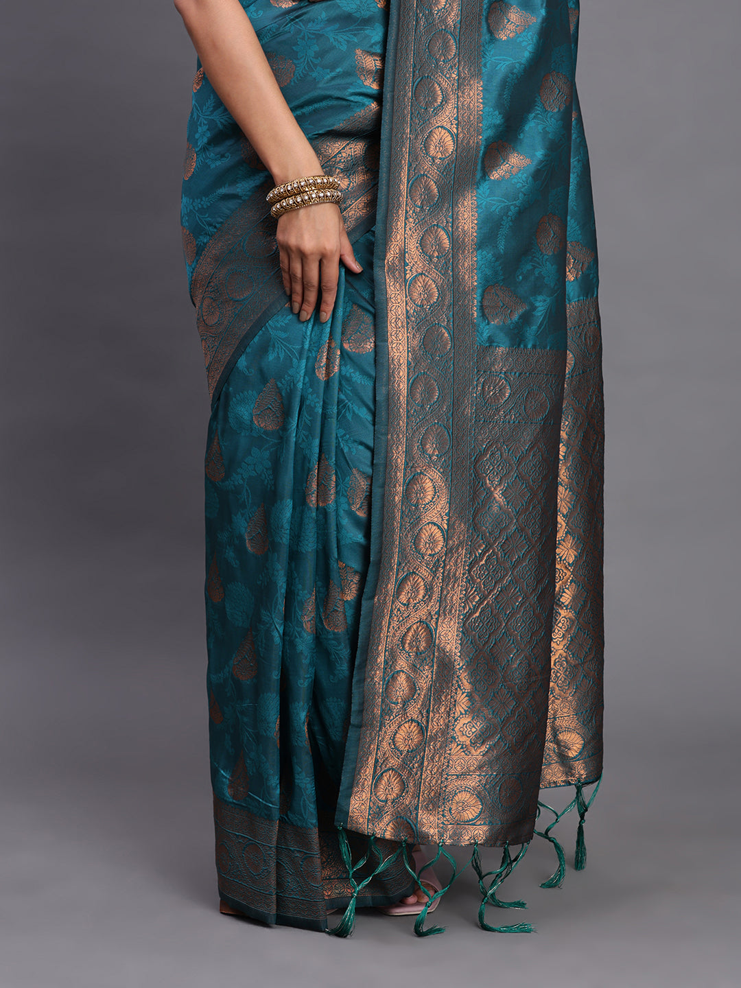 Astita Teal Blue Banarasi Silk Saree with Copper Zari Woven Pallu & Feather Butta – Wedding & Festive Wear