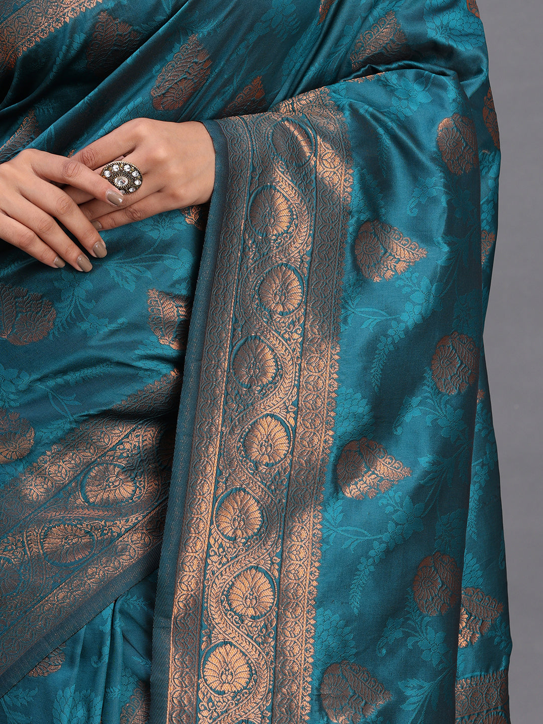 Astita Teal Blue Banarasi Silk Saree with Copper Zari Woven Pallu & Feather Butta – Wedding & Festive Wear