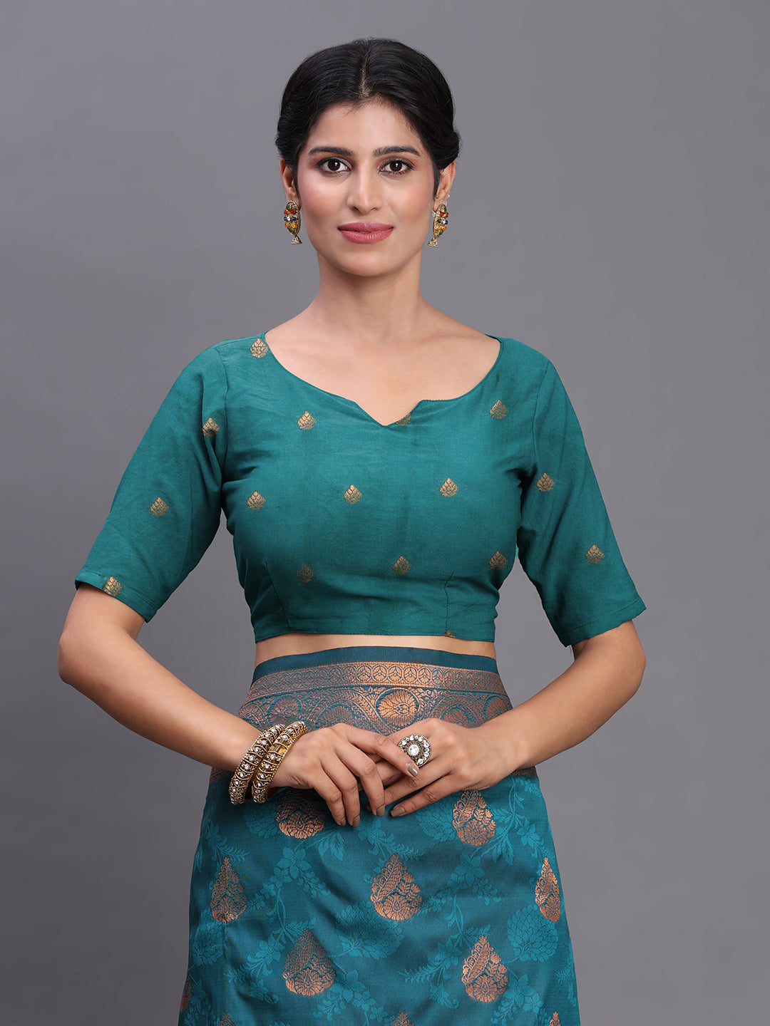 Astita Teal Blue Banarasi Silk Saree with Copper Zari Woven Pallu & Feather Butta – Wedding & Festive Wear