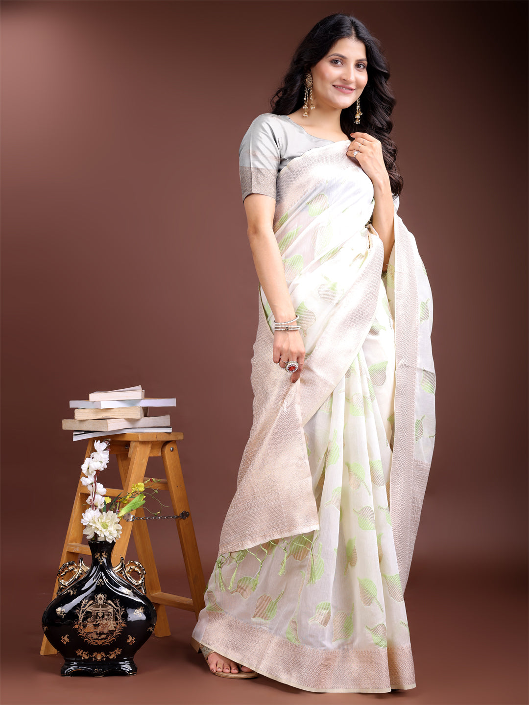 Astita Elegant White & Light Green Leaf Print Cotton Saree for Women with Zari Border & Tassels – Soft & Lightweight Daily Wear Saree