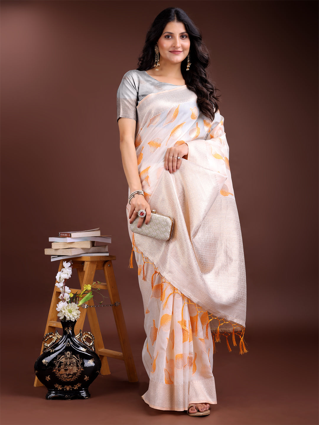 Astita Elegant White & Orange Leaf Print Cotton Saree for Women with Zari Border & Tassels – Soft & Lightweight Daily Wear Saree