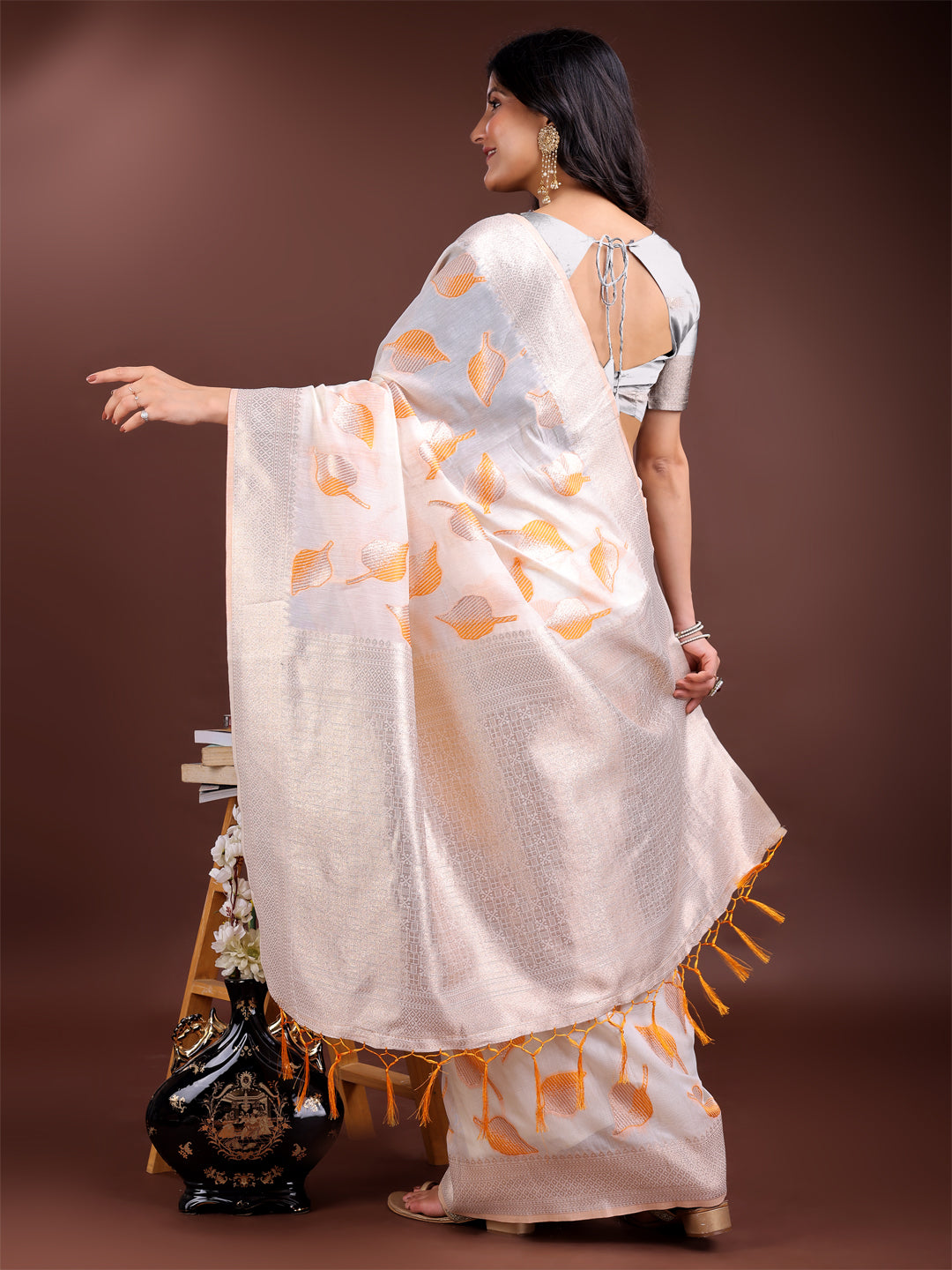 Astita Elegant White & Orange Leaf Print Cotton Saree for Women with Zari Border & Tassels – Soft & Lightweight Daily Wear Saree