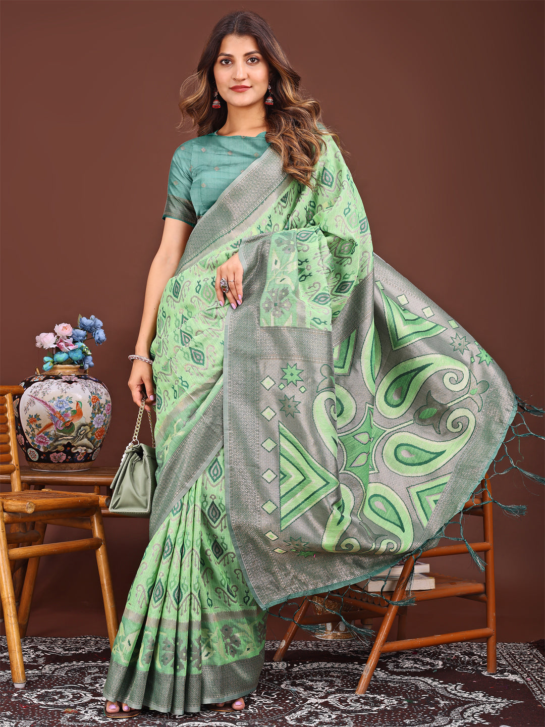 Astita Grace in Every Thread: Light green Patola Linen Cotton Saree Woven with Cultural Elegance