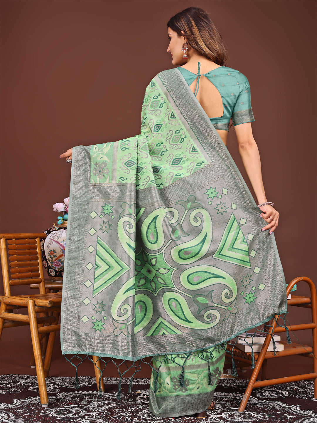 Astita Grace in Every Thread: Light green Patola Linen Cotton Saree Woven with Cultural Elegance