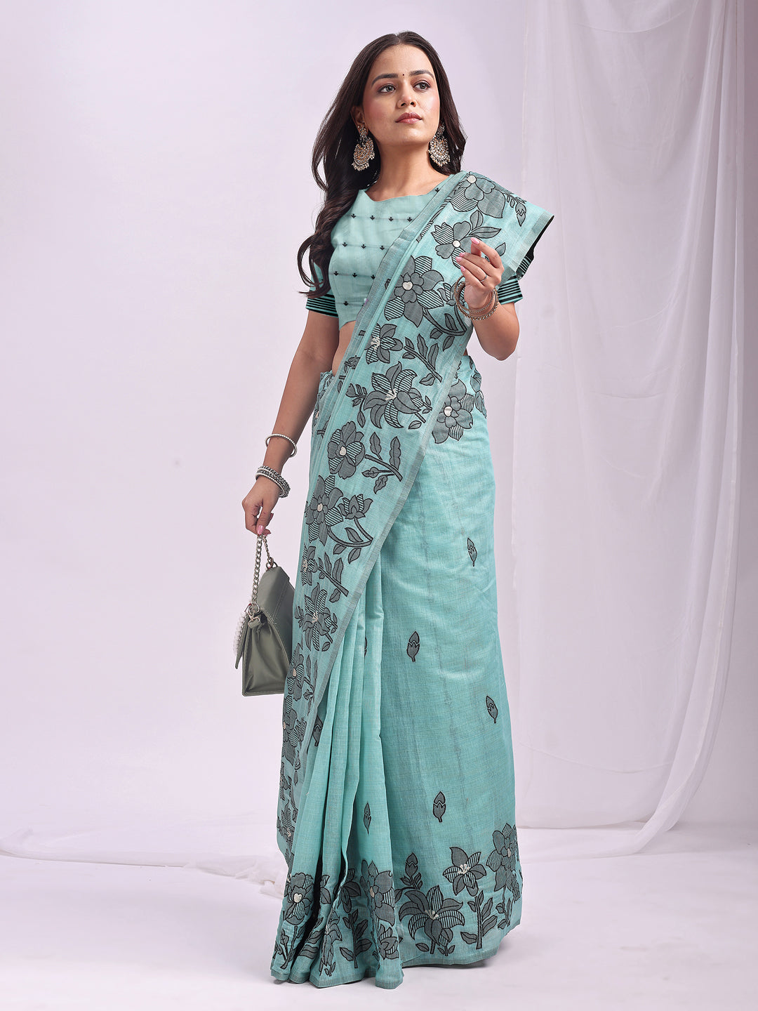 Astita Aqua Blue Linen Cotton Saree with Elegant Black Floral Print β Lightweight & Stylish Saree for Festive and Office Wear