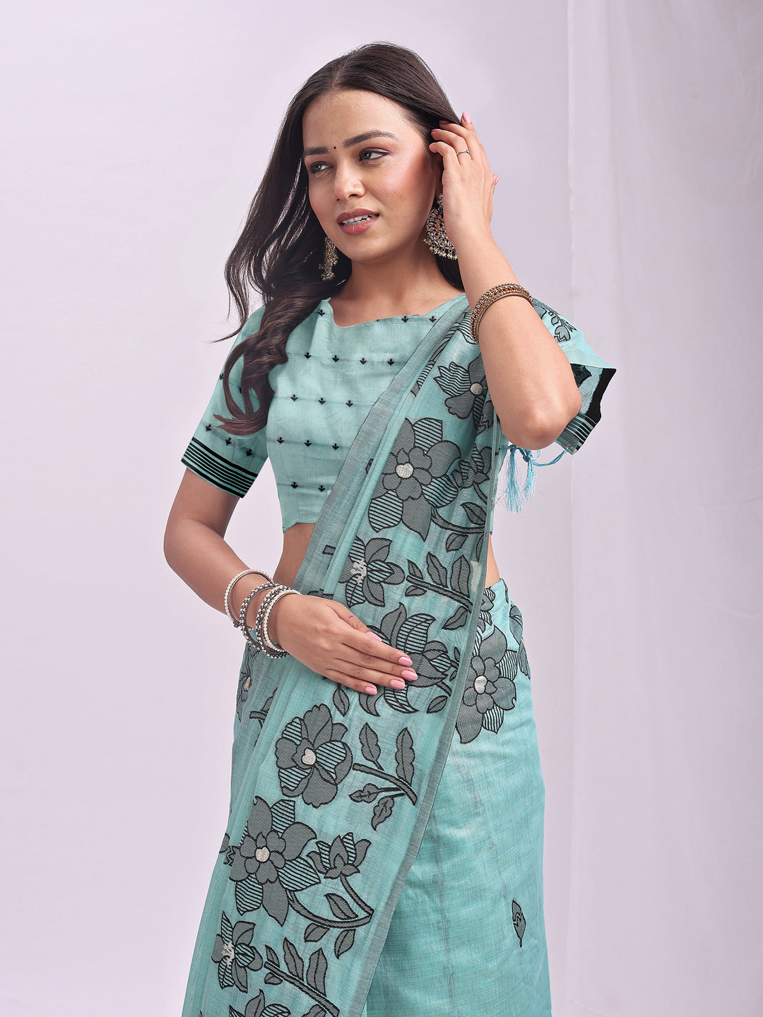 Astita Aqua Blue Linen Cotton Saree with Elegant Black Floral Print β Lightweight & Stylish Saree for Festive and Office Wear
