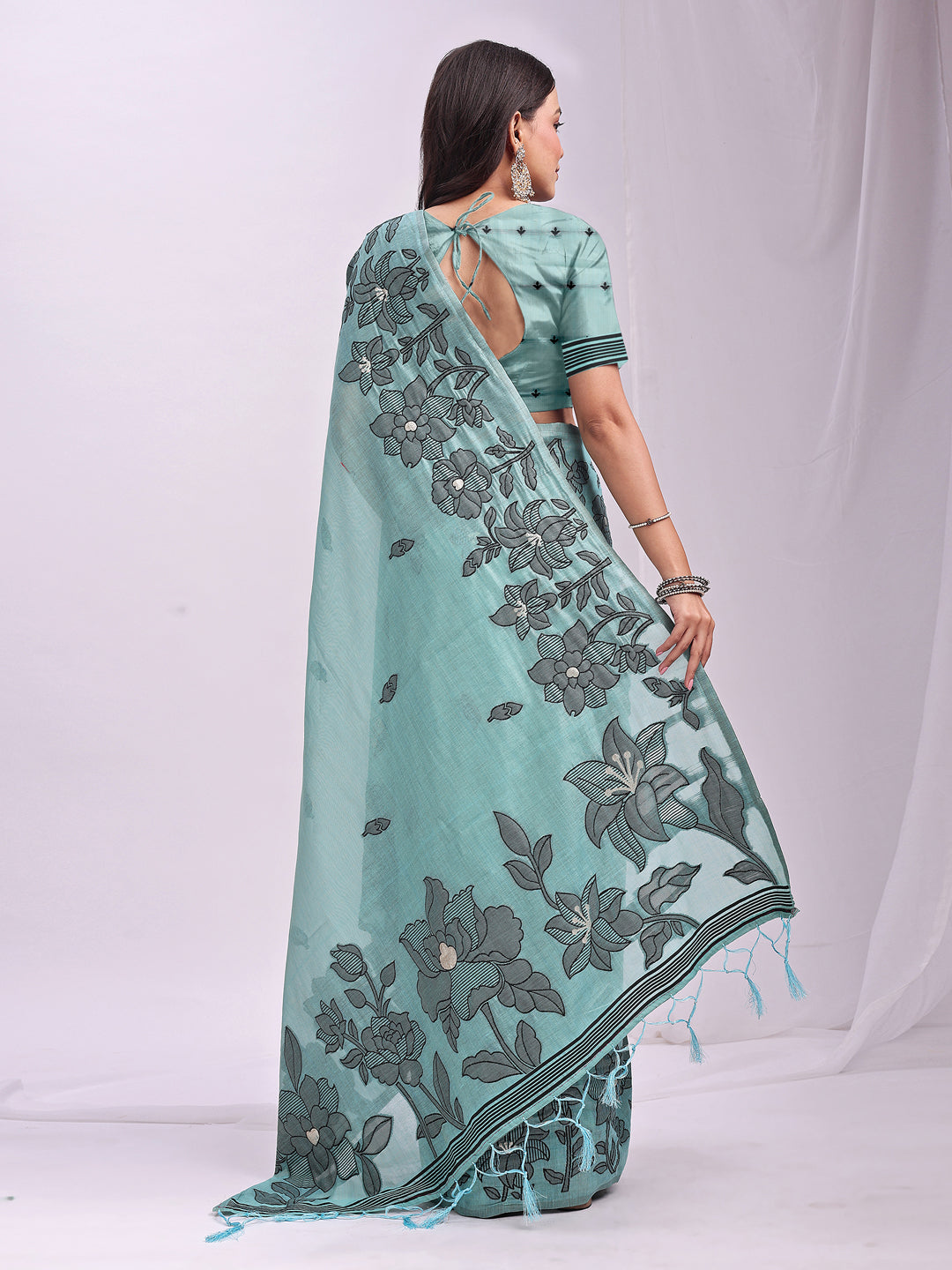 Astita Aqua Blue Linen Cotton Saree with Elegant Black Floral Print β Lightweight & Stylish Saree for Festive and Office Wear