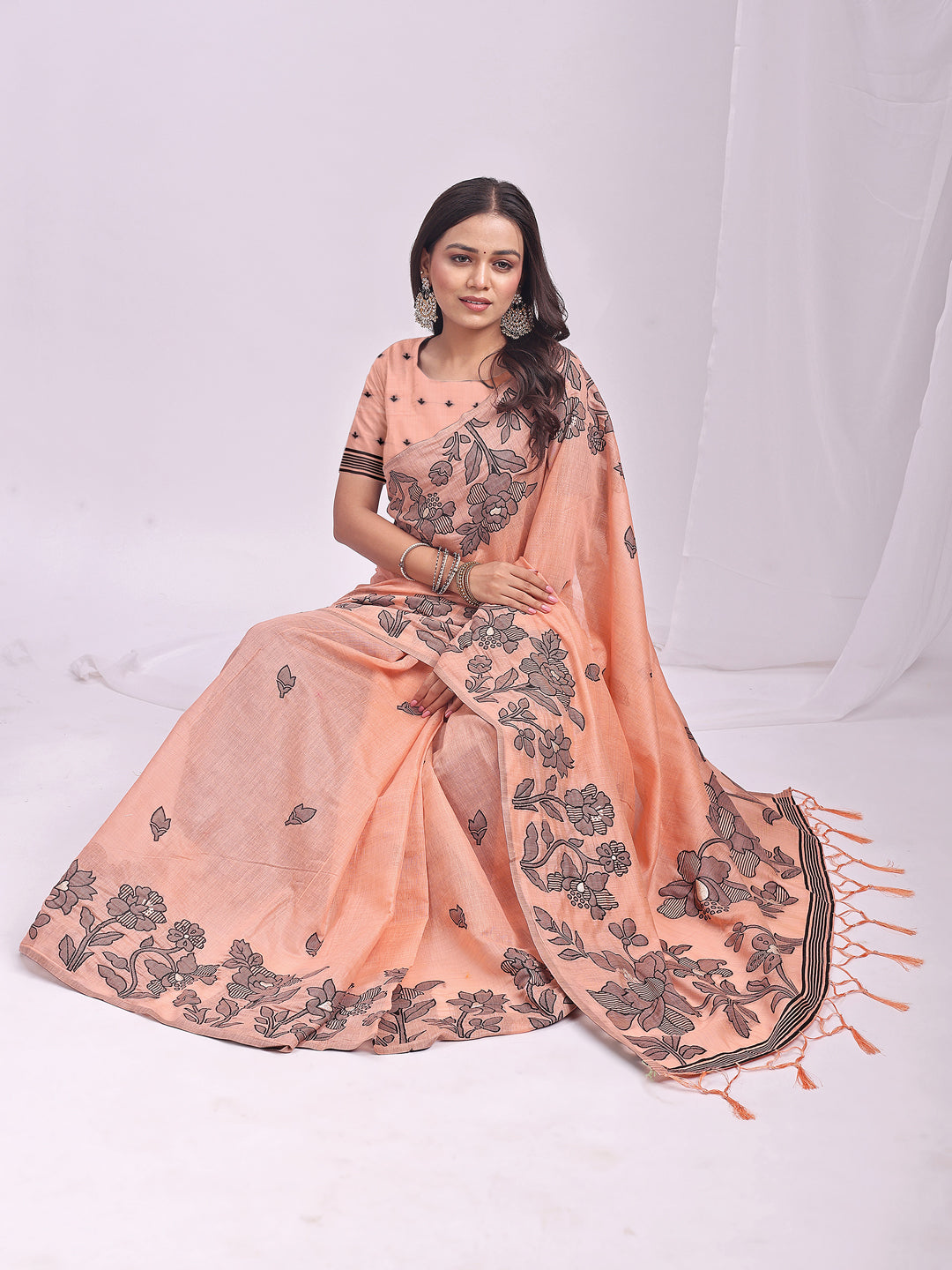 Astita Orange Linen Cotton Saree with Elegant Black Floral Print β Lightweight & Stylish Saree for Festive and Office Wear
