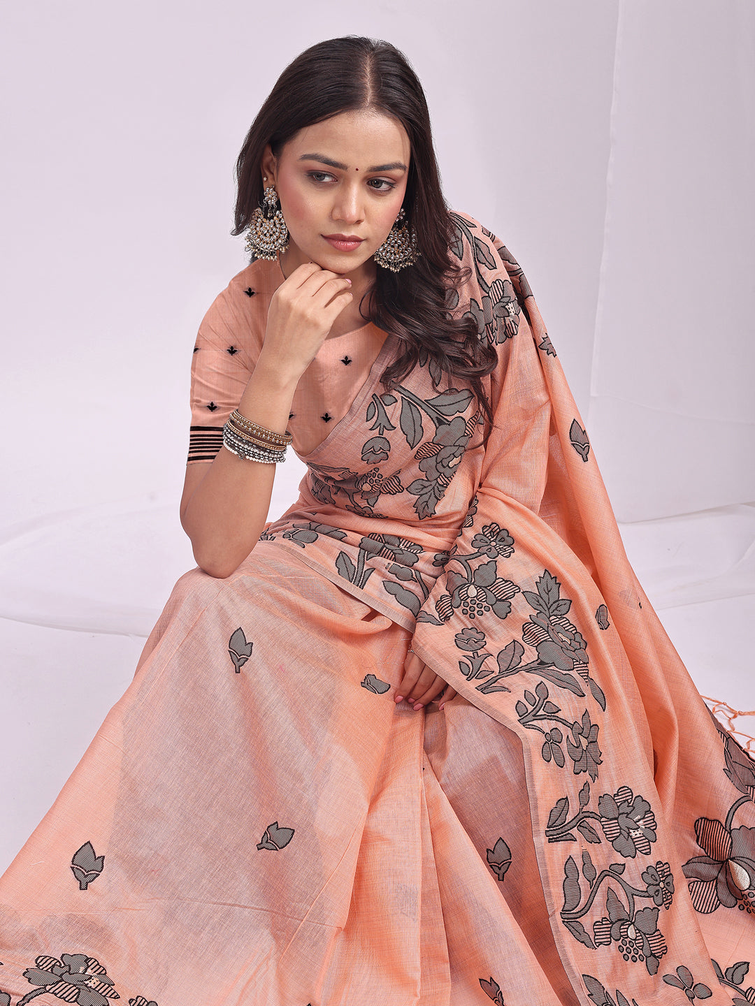 Astita Orange Linen Cotton Saree with Elegant Black Floral Print β Lightweight & Stylish Saree for Festive and Office Wear