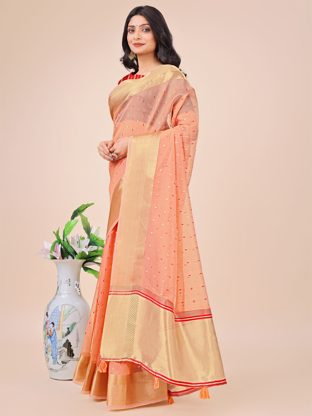 Astita Peach Gold Organza Silk Saree – Lightweight Luxury for Your Ethnic Moments