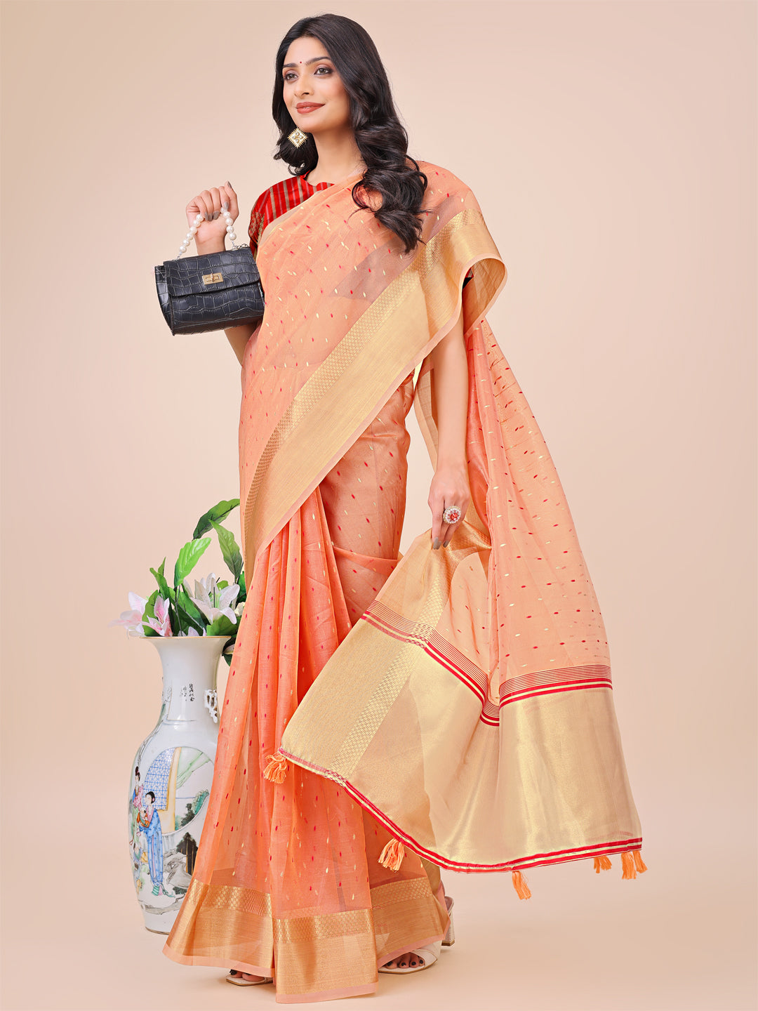 Astita Peach Gold Organza Silk Saree – Lightweight Luxury for Your Ethnic Moments