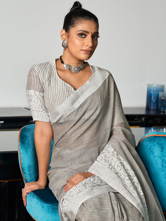Astita Elegant Grey Woven Linen Saree with Contrast Zari Border & Tassels – Soft & Breathable Party Wear