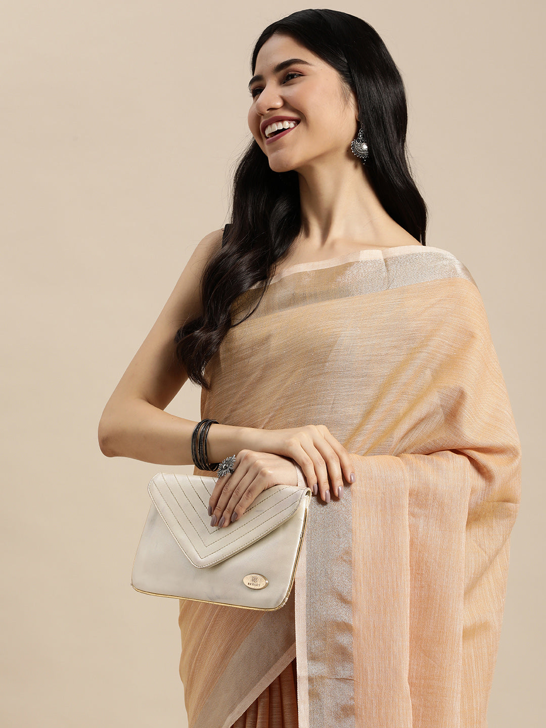 Elegant Tan Woven Linen Saree with Contrast Zari Border & Tassels – Soft & Breathable Party Wear