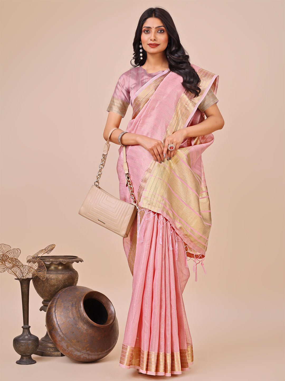 Astita Elegant Peach Organza Saree with Zari Border & Tassel Pallu – Lightweight Ethnic Wear for Festive & Wedding Occasions