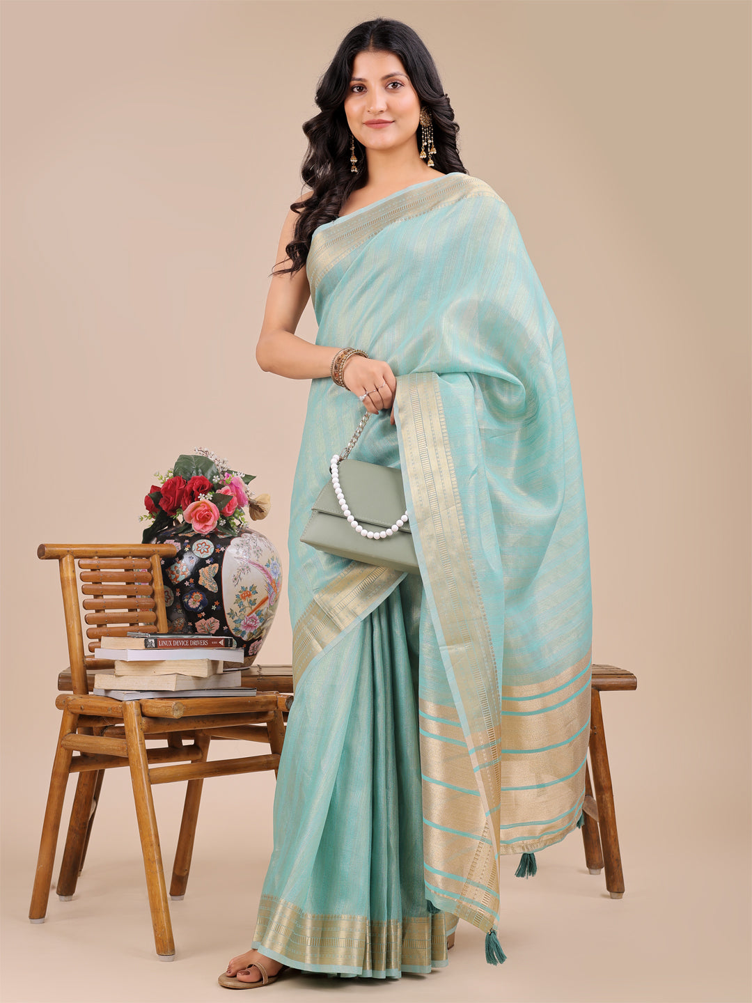 Astita Elegant Sea Green Organza Saree with Zari Border & Tassel Pallu – Lightweight Ethnic Wear for Festive & Wedding Occasions