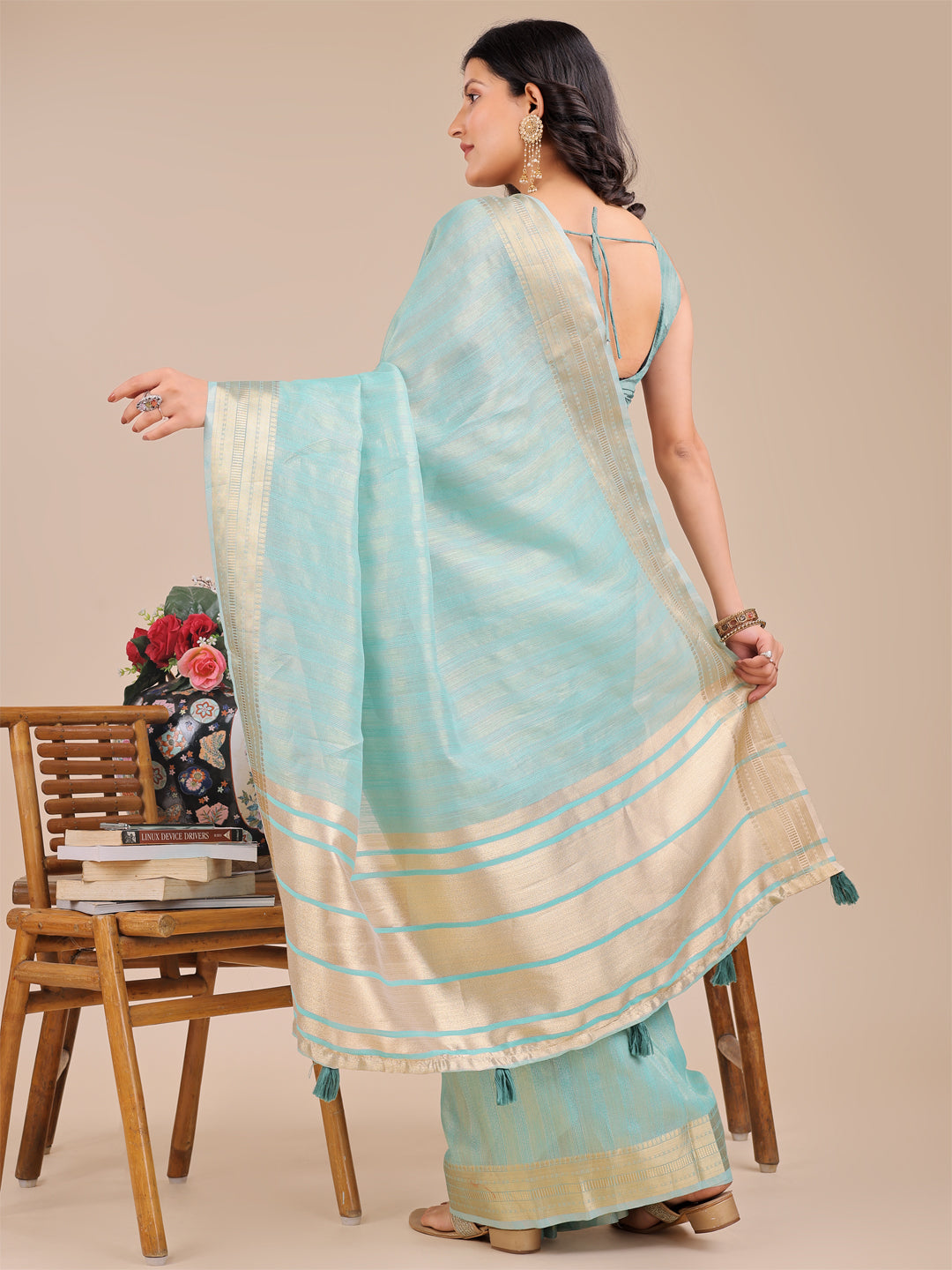 Astita Elegant Sea Green Organza Saree with Zari Border & Tassel Pallu – Lightweight Ethnic Wear for Festive & Wedding Occasions
