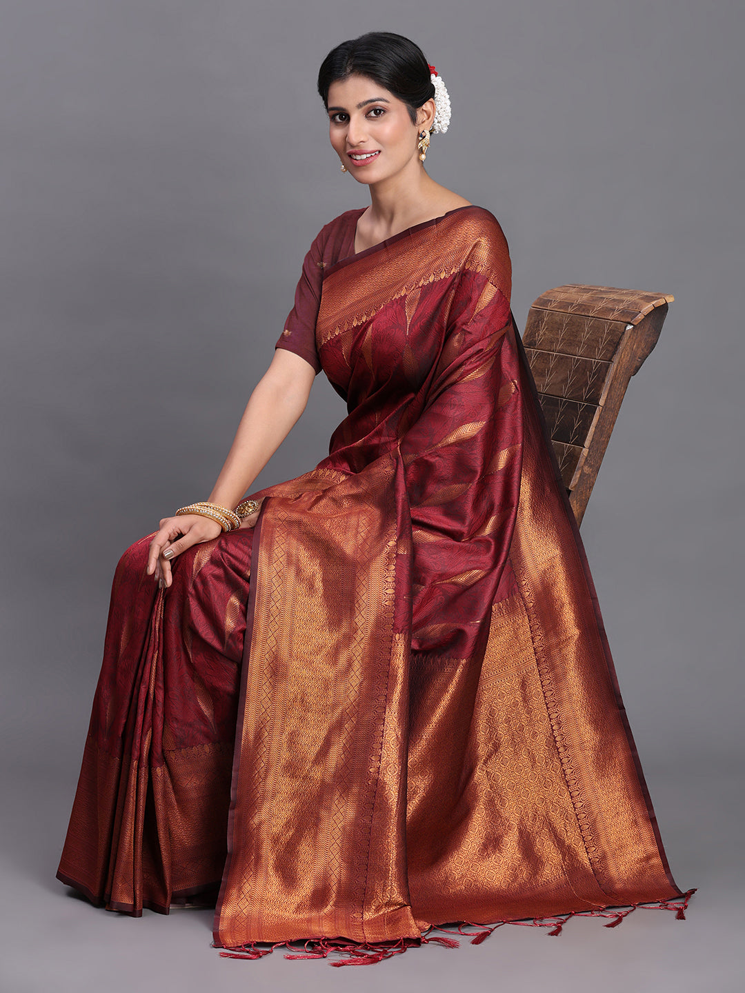 Astita Maroon Banarasi Silk Saree with Copper Zari Woven Pallu & Feather Butta – Wedding & Festive Wear