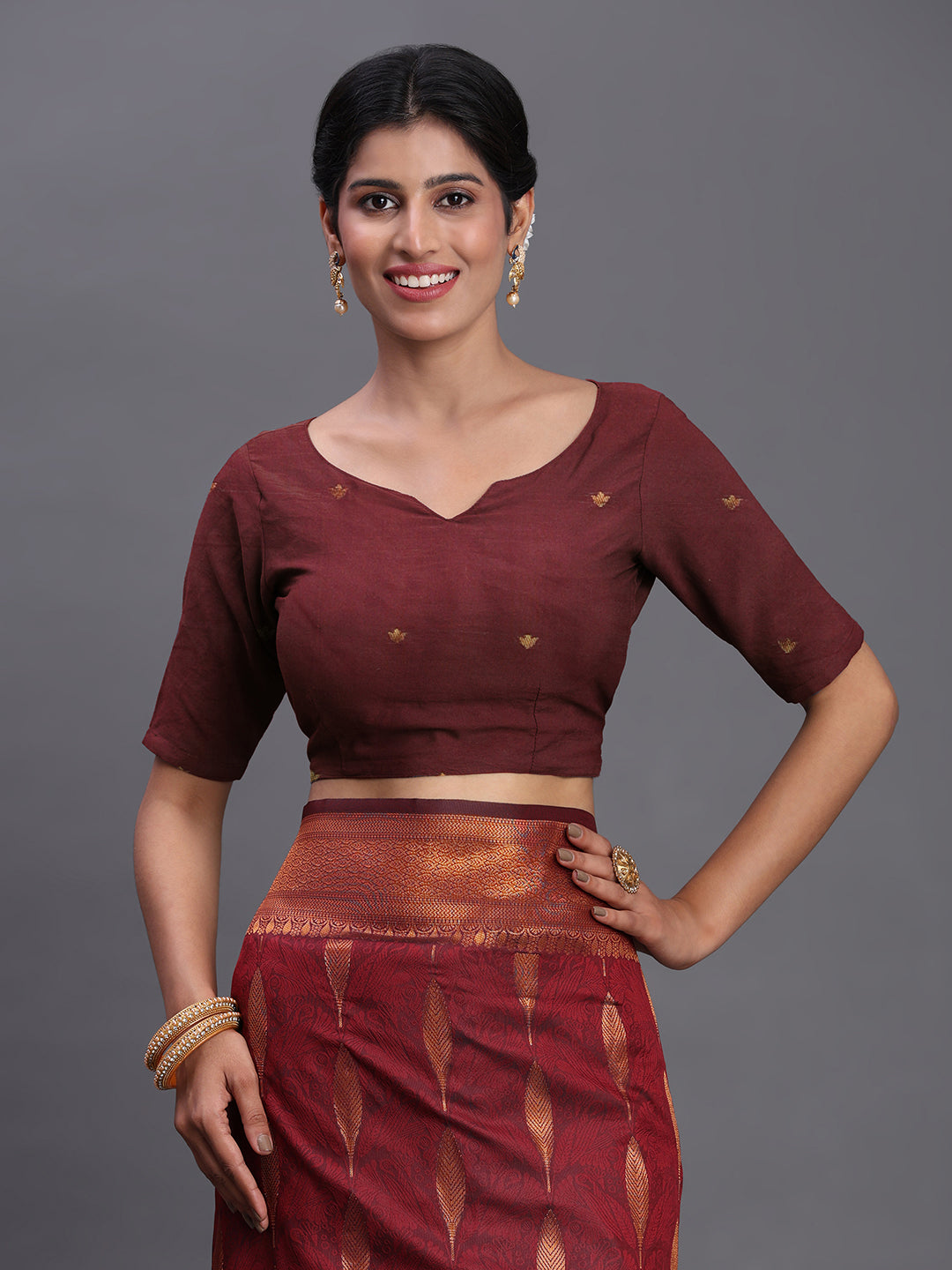 Astita Maroon Banarasi Silk Saree with Copper Zari Woven Pallu & Feather Butta – Wedding & Festive Wear