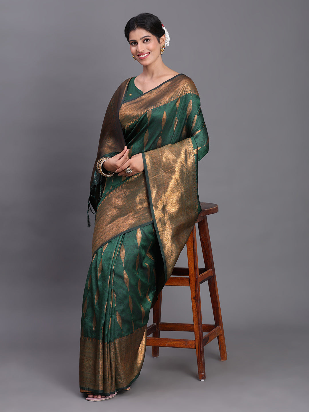 Astita Dark Green Banarasi Silk Saree with Copper Zari Woven Pallu & Feather Butta – Wedding & Festive Wear