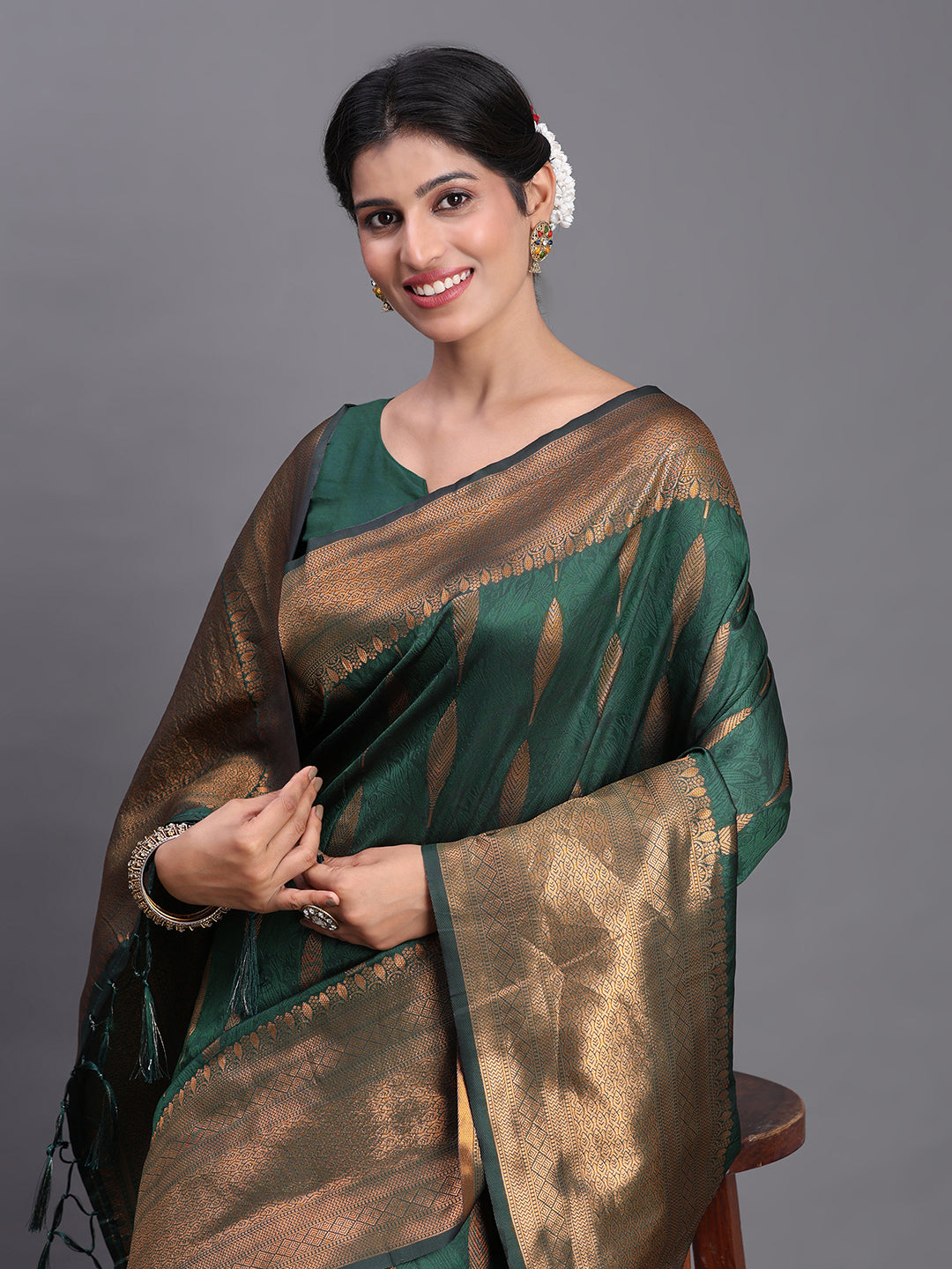 Astita Dark Green Banarasi Silk Saree with Copper Zari Woven Pallu & Feather Butta – Wedding & Festive Wear
