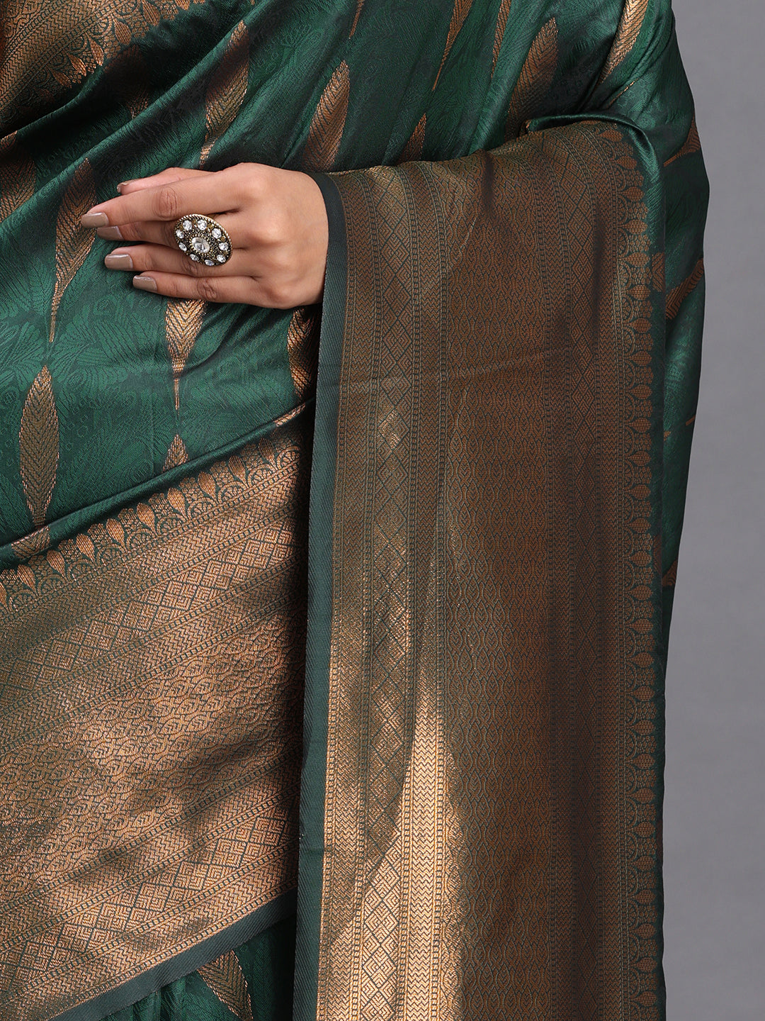 Astita Dark Green Banarasi Silk Saree with Copper Zari Woven Pallu & Feather Butta – Wedding & Festive Wear