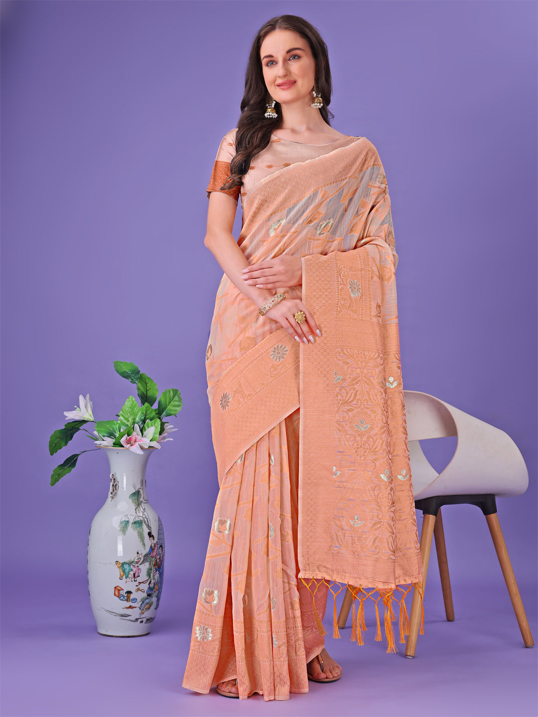 Astita Peach Lichi Silk Saree with Floral Weaving & Tassel Pallu – Elegant Festive & Party Wear Saree