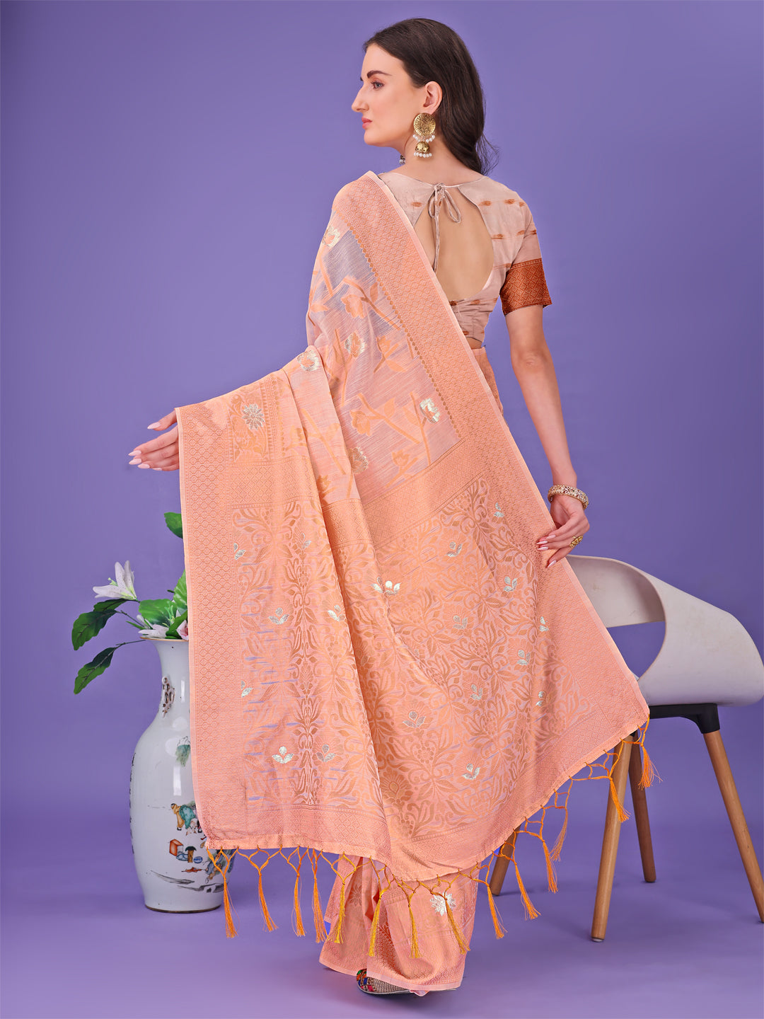 Astita Peach Lichi Silk Saree with Floral Weaving & Tassel Pallu – Elegant Festive & Party Wear Saree