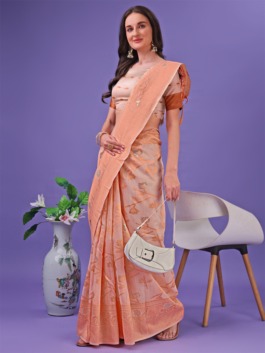 Astita Peach Lichi Silk Saree with Floral Weaving & Tassel Pallu – Elegant Festive & Party Wear Saree