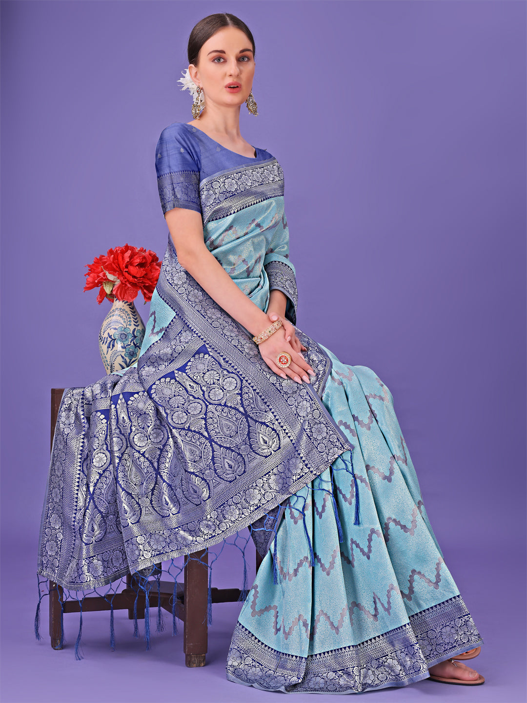 Astita Sky Blue & Green Lichi Silk Saree with Rich Woven Border and Zigzag Pattern – Wedding & Festive Wear