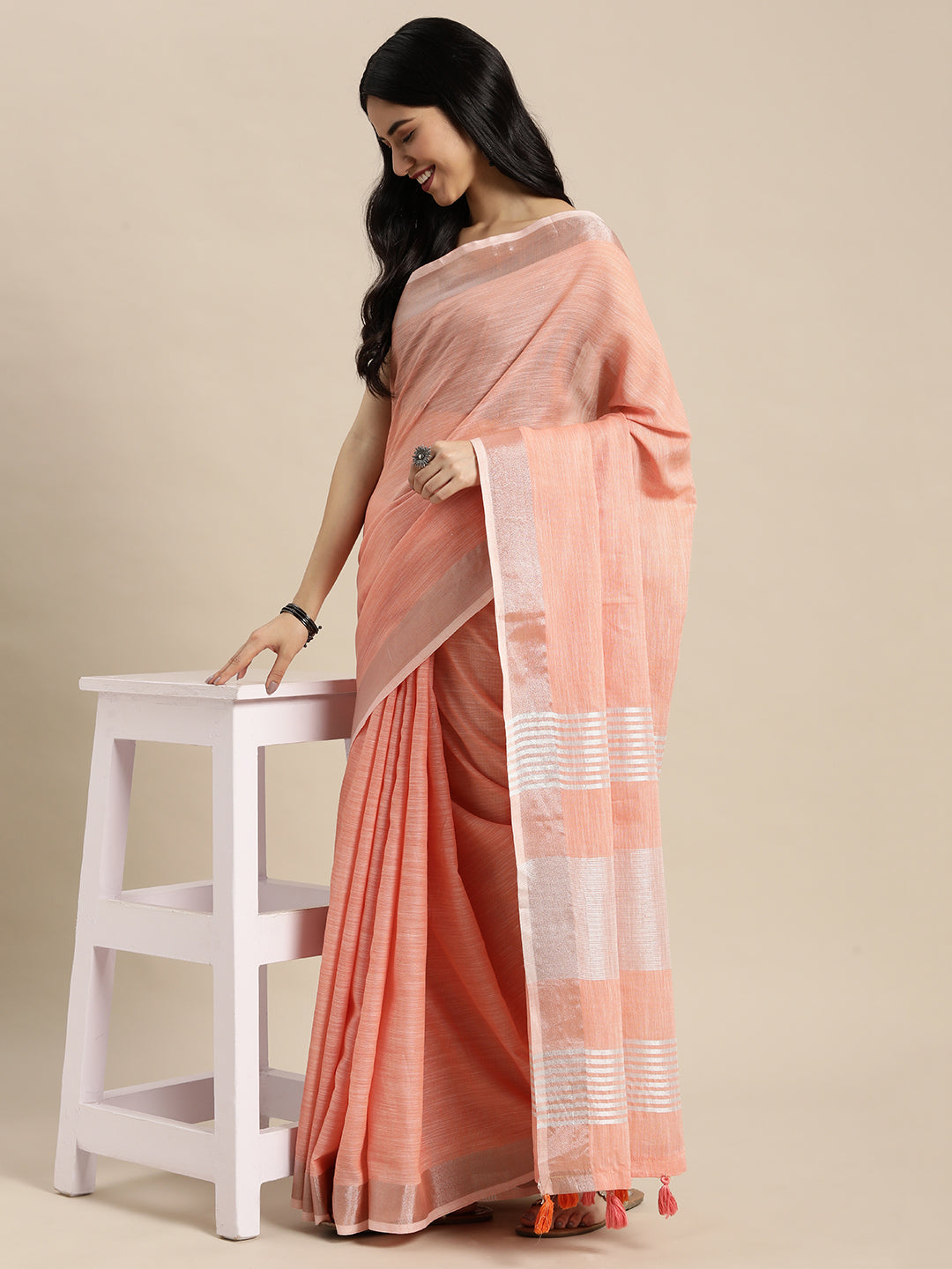 Peach Woven Linen Blend Saree with Silver Zari Border and Tassels