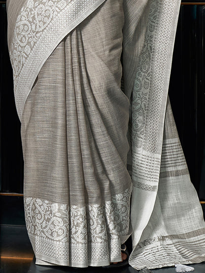 Astita Elegant Grey Woven Linen Saree with Contrast Zari Border & Tassels – Soft & Breathable Party Wear