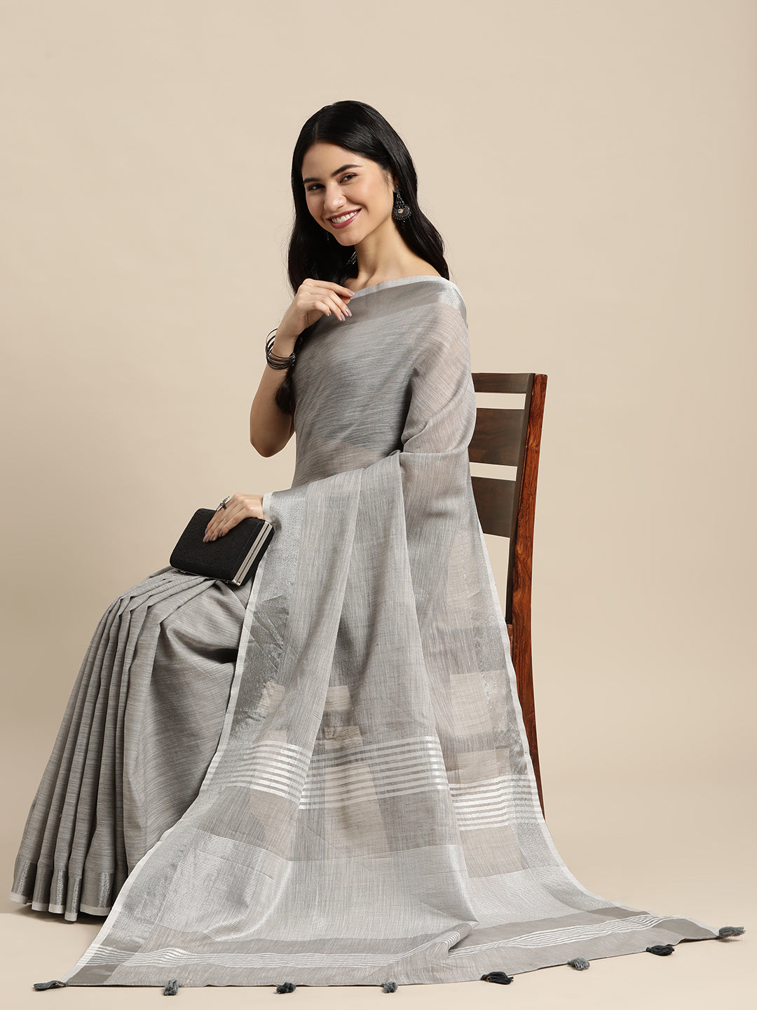Astita Elegant Light Grey Woven Linen Saree with Contrast Zari Border & Tassels – Soft & Breathable Party Wear