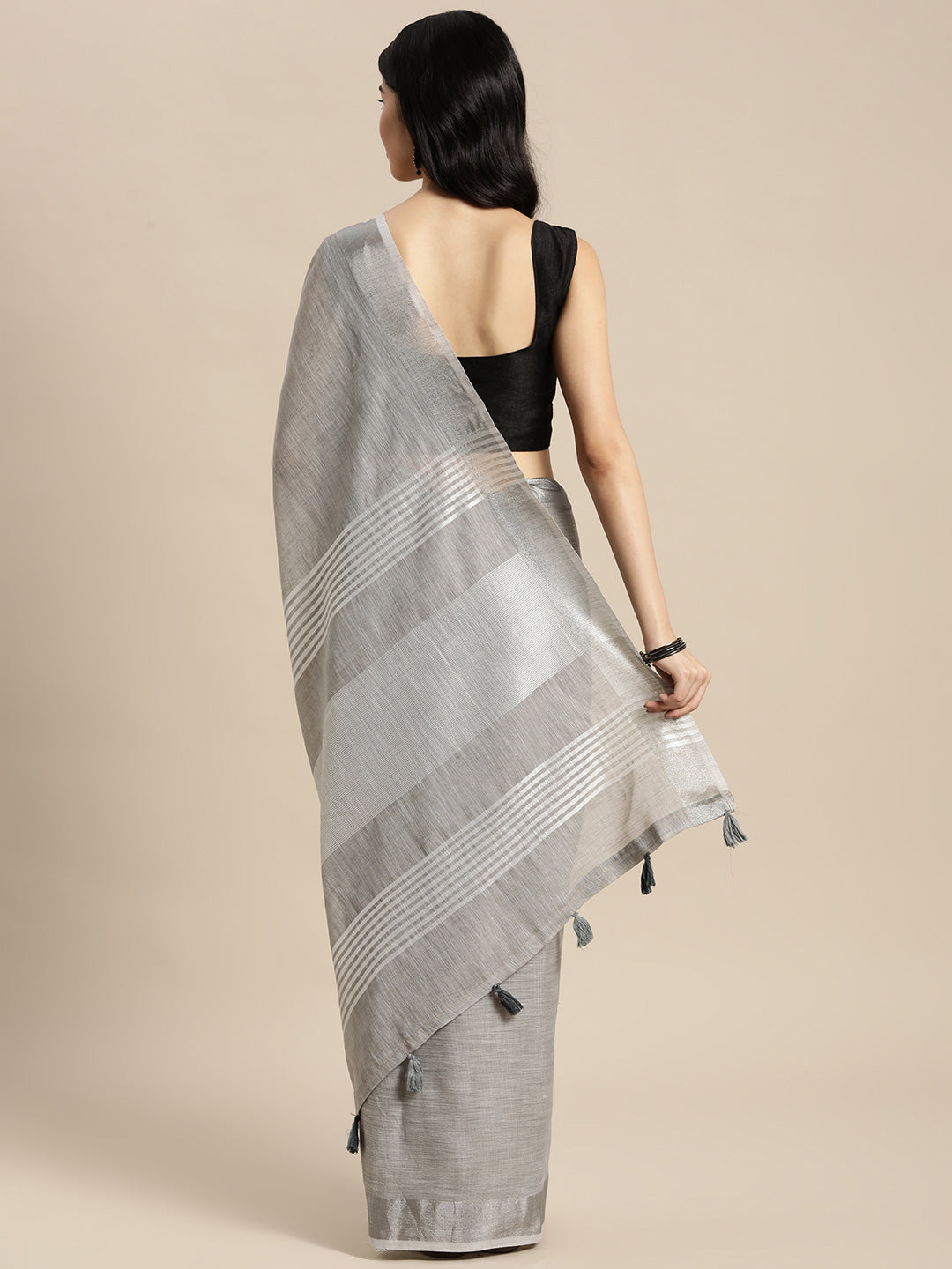 Astita Elegant Light Grey Woven Linen Saree with Contrast Zari Border & Tassels – Soft & Breathable Party Wear