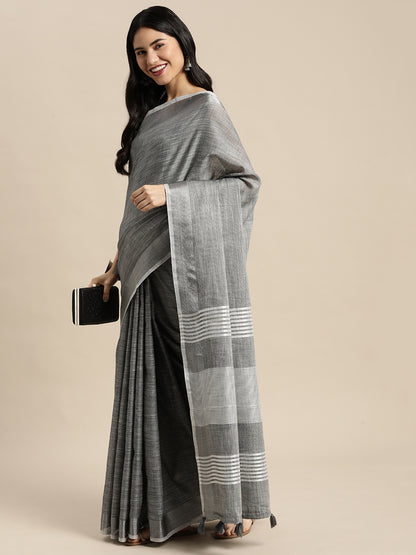 Astita Elegant Dark Grey Woven Linen Saree with Contrast Zari Border & Tassels – Soft & Breathable Party Wear