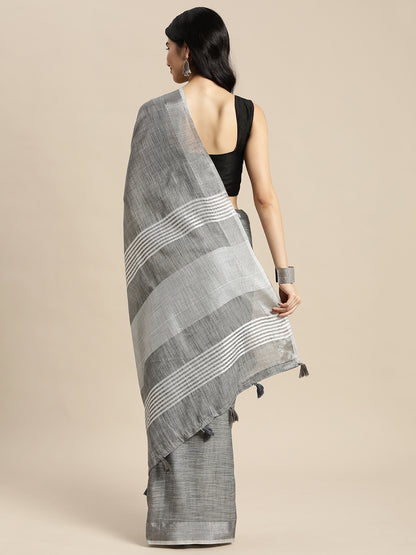 Astita Elegant Dark Grey Woven Linen Saree with Contrast Zari Border & Tassels – Soft & Breathable Party Wear