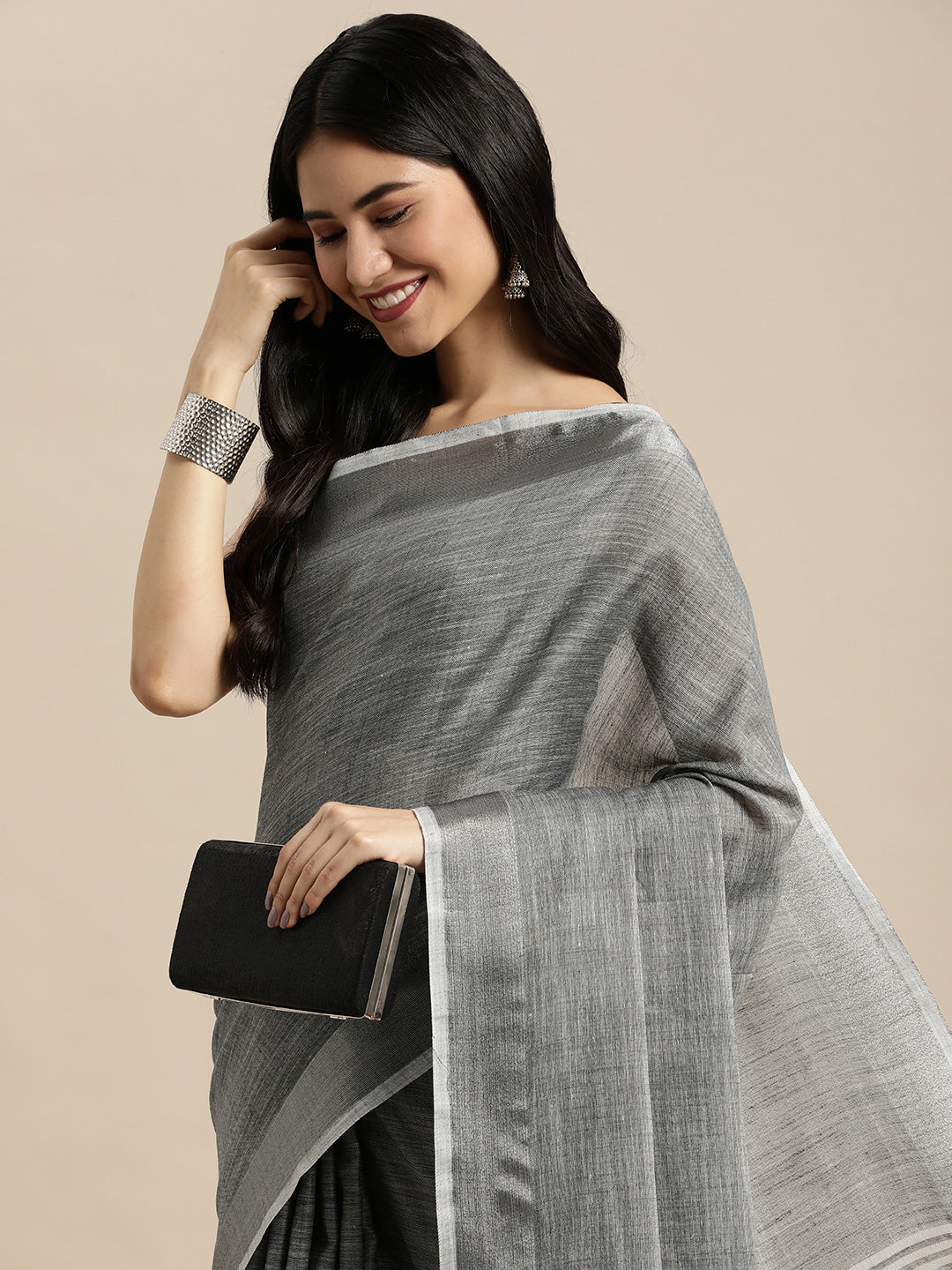 Astita Elegant Dark Grey Woven Linen Saree with Contrast Zari Border & Tassels – Soft & Breathable Party Wear