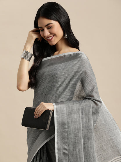 Astita Elegant Dark Grey Woven Linen Saree with Contrast Zari Border & Tassels – Soft & Breathable Party Wear