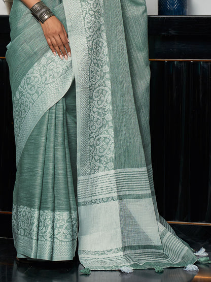 Elegant Sea Green Woven Linen Saree with Contrast Zari Border & Tassels – Soft & Breathable Party Wear