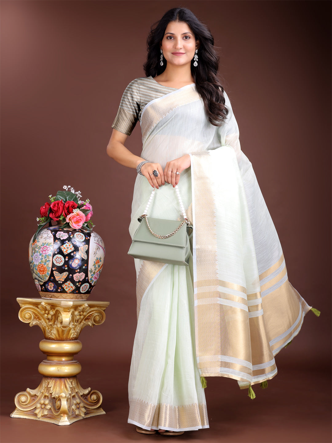 Astita Elegant Light Green Woven Linen Saree with Contrast Zari Border & Tassels – Soft & Breathable Party Wear