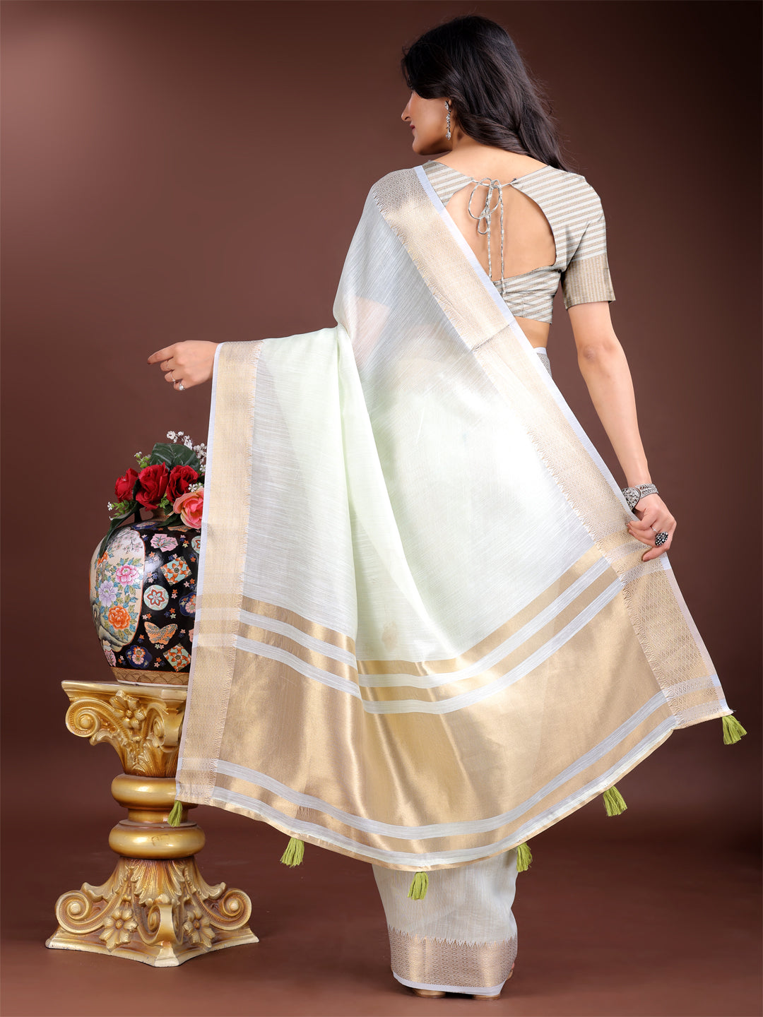 Astita Elegant Light Green Woven Linen Saree with Contrast Zari Border & Tassels – Soft & Breathable Party Wear