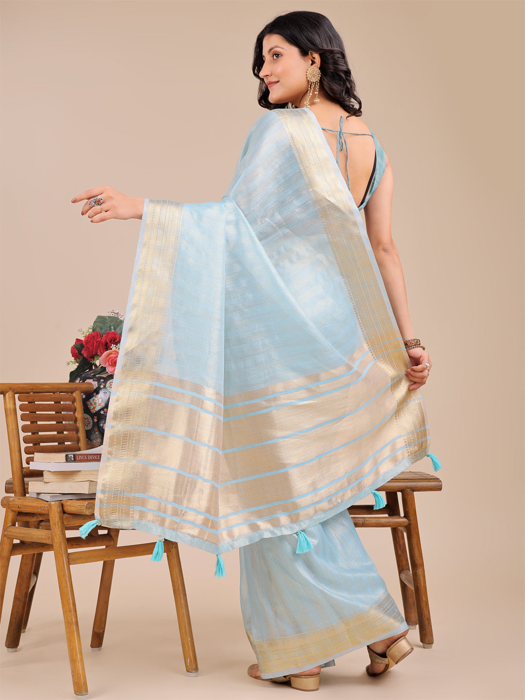 Astita Elegant Sky Blue Organza Saree with Zari Border & Tassel Pallu – Lightweight Ethnic Wear for Festive & Wedding Occasions